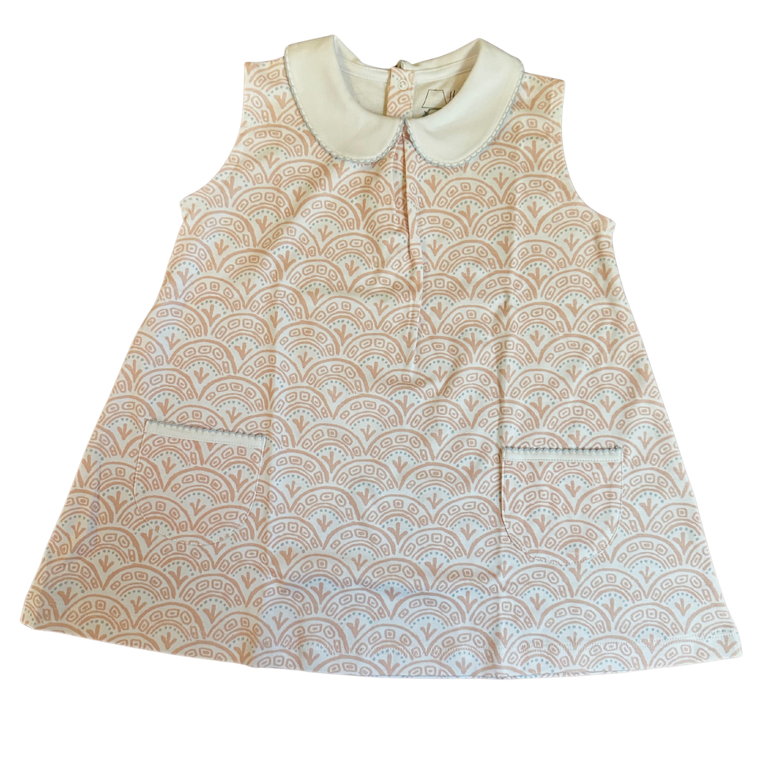 white dress with pink swirls and white collar